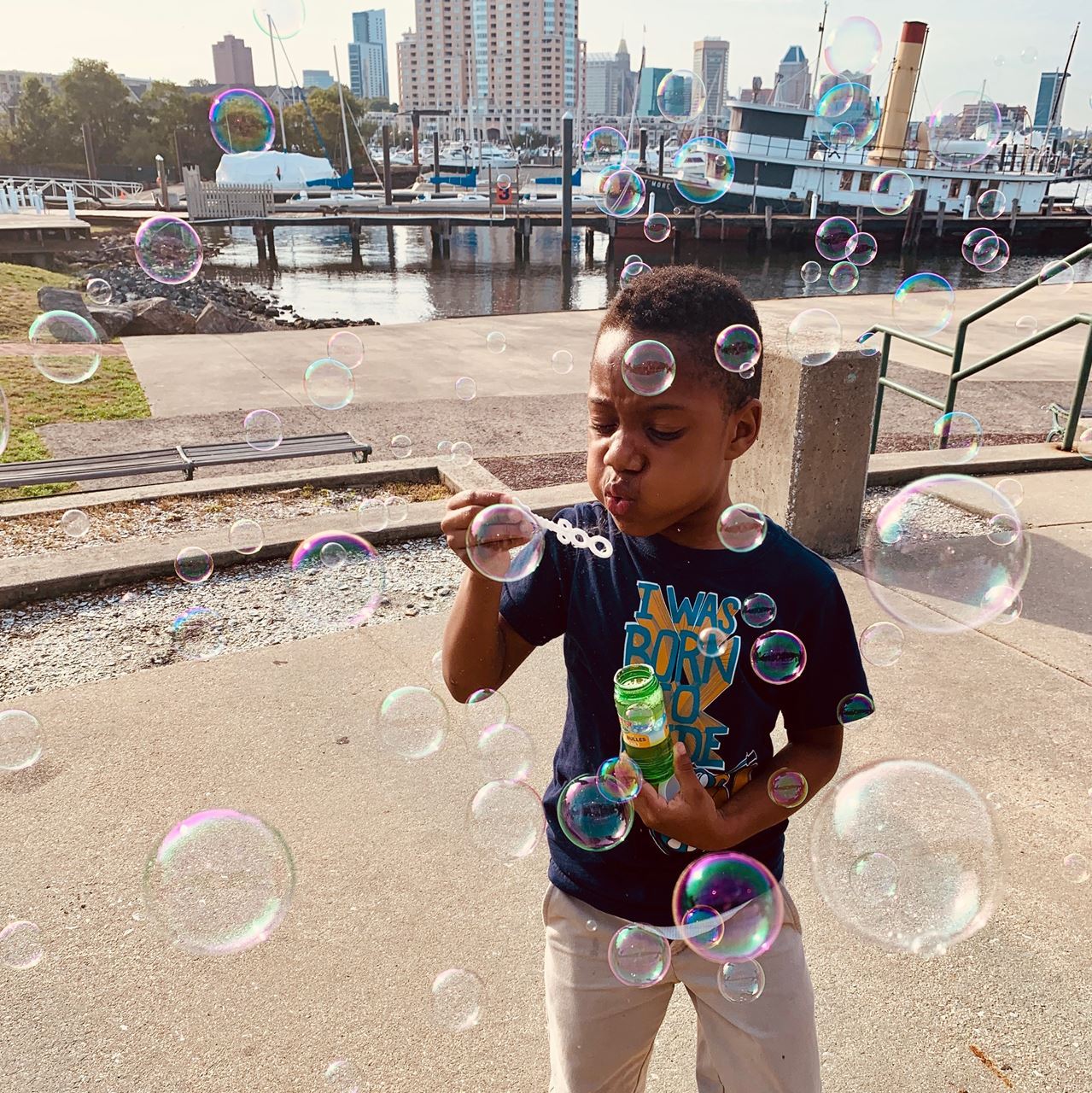Baybrook OST student learns about wind by blowing bubbles