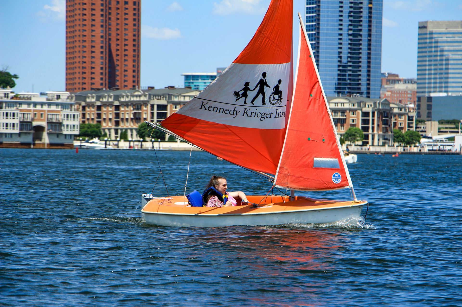 Nicole, one of our disabled sailor, single handing an Access Dinghy in Baltimore Harbor