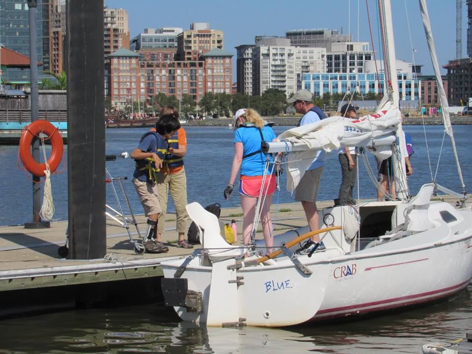 A Freedom Independence 20 Sailboat is readied for sailors to embark on a sunny harbor sail!